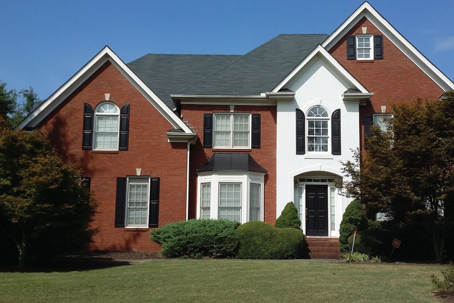 This red brick home is about to become painted brick.